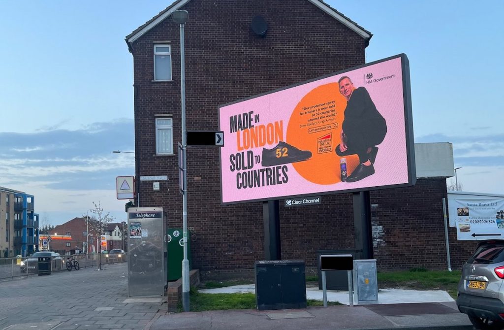A large digital billboard outside a residential building. 