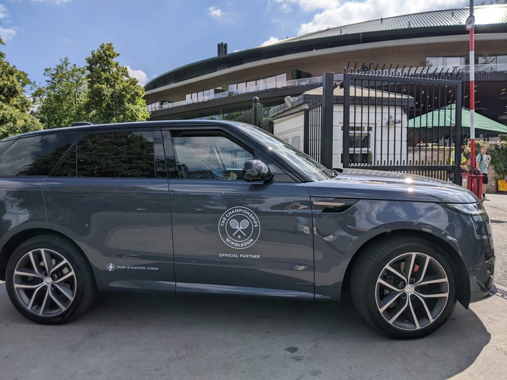 A Range Rover SUV with the Wimbledon logo on the door.